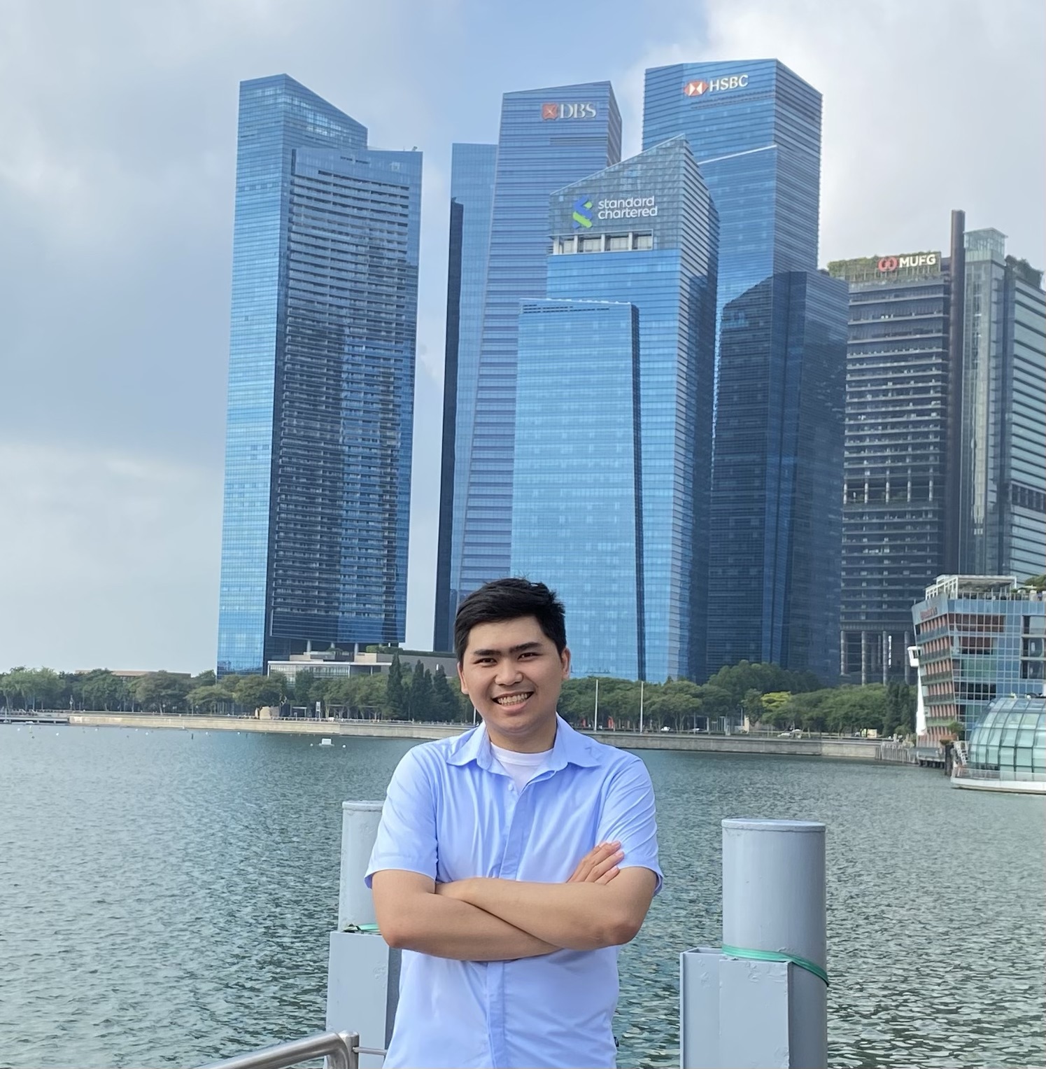 Tri Doan standing by the waterfront in Singapore